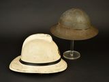two hats sitting next to each other on a table