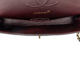 a chanel burgundy leather shoulder bag with gold hardware