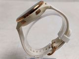 a close up of a watch on a clear stand