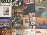 a lot of different album covers on the wall