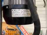 a machine that is sitting on a table in a garage