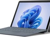 une image représentant une tablette équipée d'un clavier posé dessus
