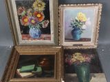 three framed paintings of flowers in vases on a table