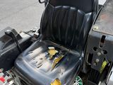 an image of a tractor with a seat that has been left on the ground