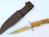 a knife and sheath on a white surface