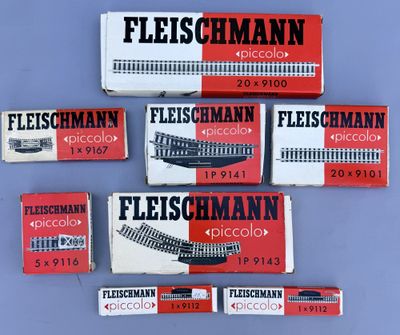 four boxes of fleischmann cigarettes on a blue surface