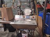 a machine that is sitting on a table in a garage