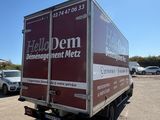 a delivery truck that is parked in a parking lot