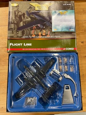 a toy airplane that is in the box on the table