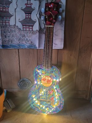 a guitar that is sitting on the floor in the room