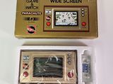a gold game console with a game on the screen