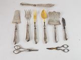 many different types of silverware on the table
