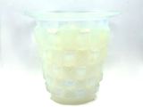 a glass vase that has a lot of small pieces of glass in it