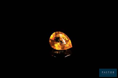 a yellow diamond on a black background