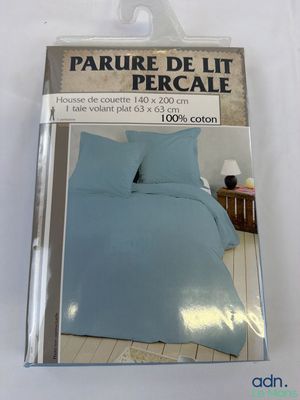 packaging of a bed with a blue comforter and a pillow