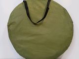 olive green round bag with black strap
