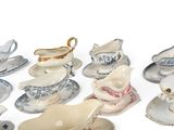 a lot of different types of porcelain dishes and saucers