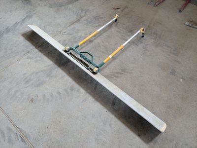 a long piece of metal laying on the floor