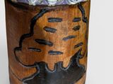 a close up of a wooden object with a net on it