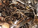 a pile of assorted jewelry on a table