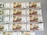 many different bank notes laid out on a table