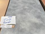 a stack of boxes with a sign on top of it