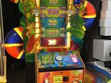 a game machine that has a clock on the front of it