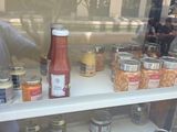 a display of condiments and condiments in a store window