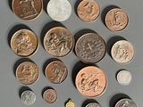 a lot of coins that are on the table