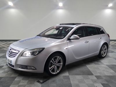 a picture of a silver car parked on a checkered floor