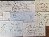 many old envelopes on a wooden table