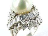 an image of a pearl and diamond ring on a white background