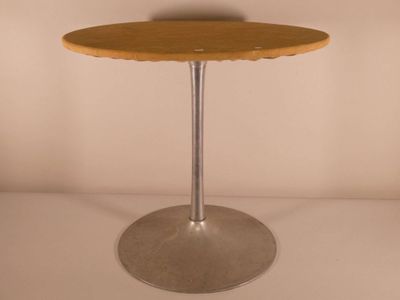a small wooden table with a metal base on a white surface