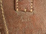 a close up of a piece of luggage with a button