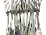 a lot of forks that are stacked on top of each other