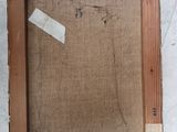 an old picture frame with a piece of paper taped to the bottom of it