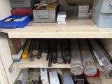 many different types of tools on the shelf in the cabinet