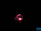 a pink diamond on a black background