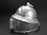a silver helmet with a bird on top of it