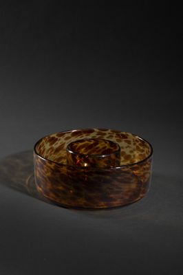 a glass bowl that is sitting on a table