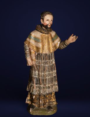 a statue of a man with a beard and a dress