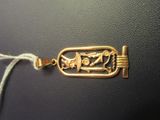 an image of a gold plated bracelet with a design on it