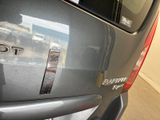 a close up of the back of a car with the word toto on it