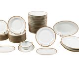 a lot of plates that are sitting on a table