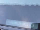 a close up of the dashboard of a car with a clock on it