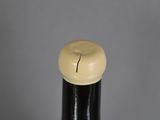 a close up of a wooden stick with a ball on top of it