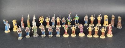 a lot of figurines that are sitting on a table