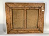 an old wooden frame with a glass window on the inside