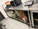a laptop and a microwave on the counter in the kitchen