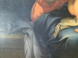 a painting of a woman holding a baby in her lap
